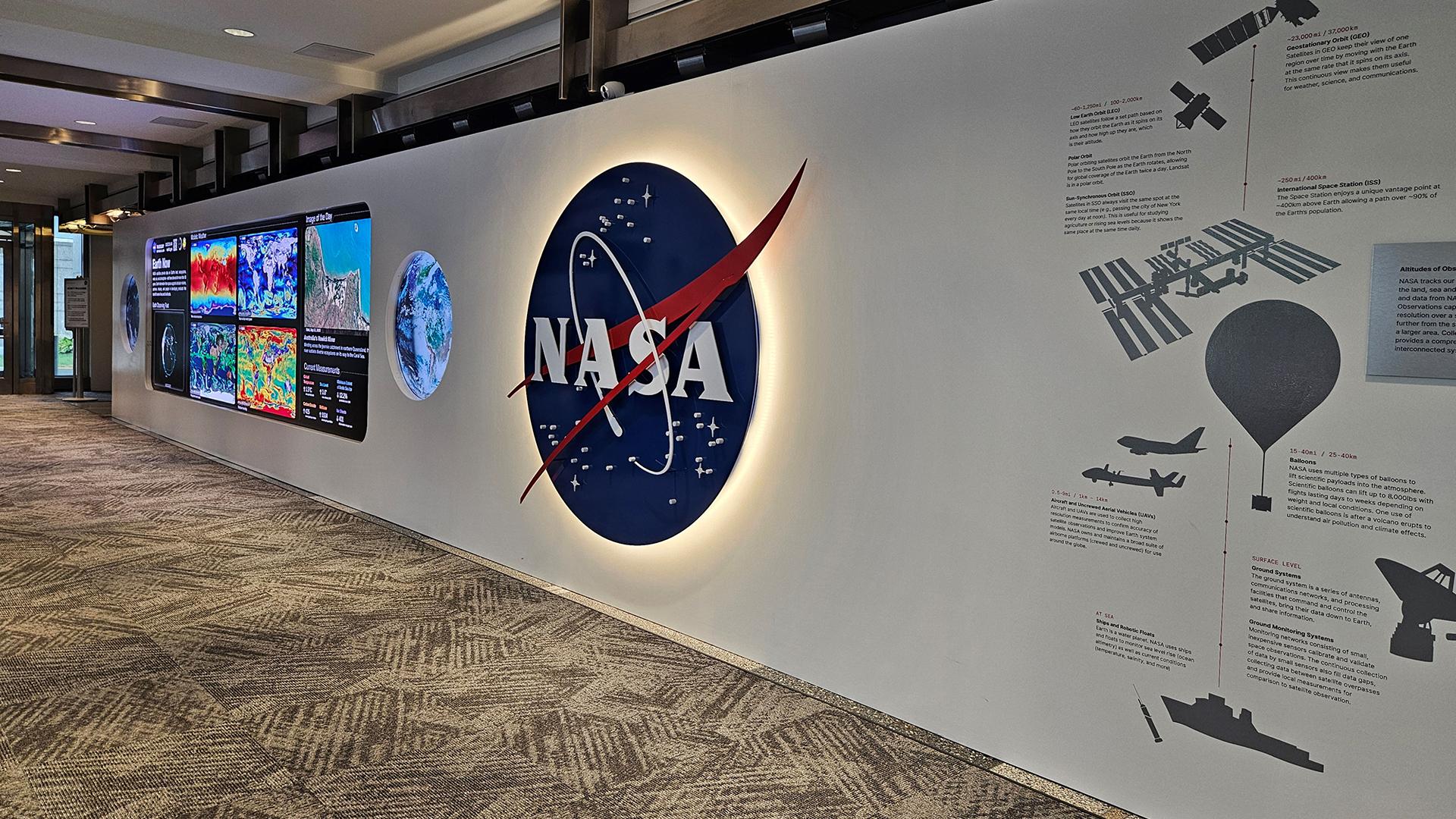 The Earth Information Center exhibit at NASA Headquarters showing visitors and displays.